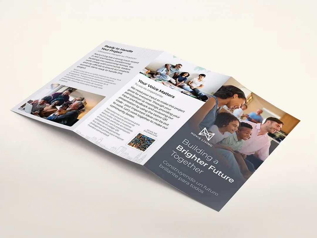 Novis Living bilingual community brochure displayed open on a cream background