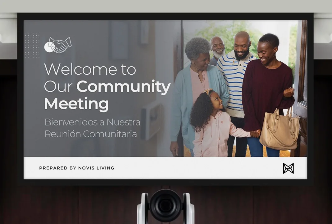 Novis Living bilingual community meeting presentation displayed on a screen in a conference room