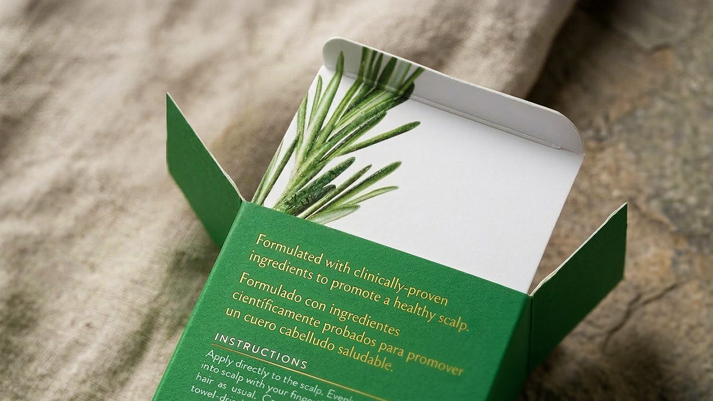 Open green Tatiana Irizar box showing bilingual copy and botanical artwork
