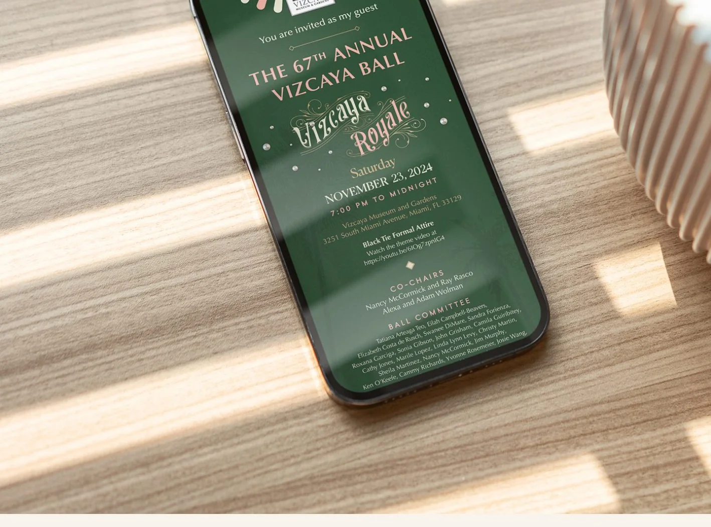 The 67th Annual Vizcaya Ball digital invitation shown on a phone