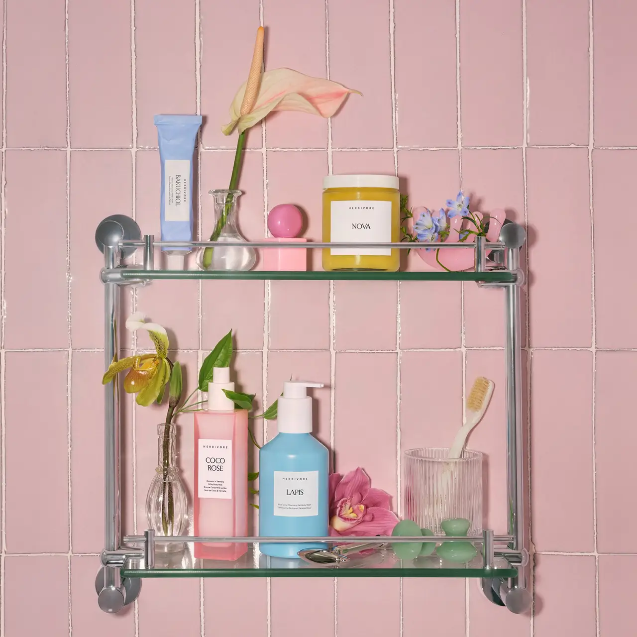 Set of cosmetics on a tiled wall.