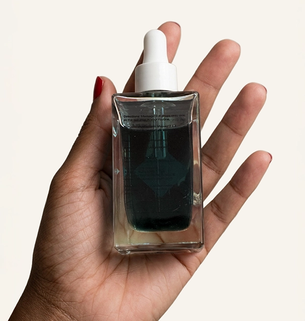 Hand holding up current product.